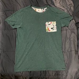 On the Byas. Floral and Green shirt